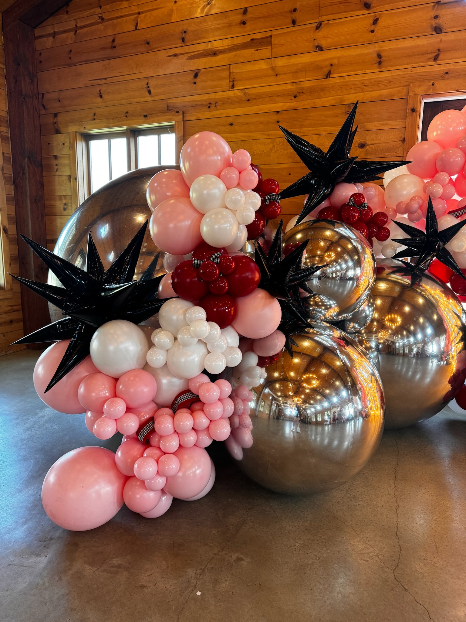 Detailed picture of large balloon arch, featuring balloons from Big Shiny Balls.