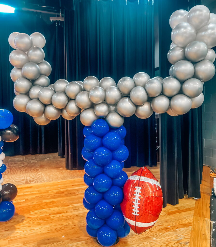 Balloon mosaic of a football goalpost with football balloon attached