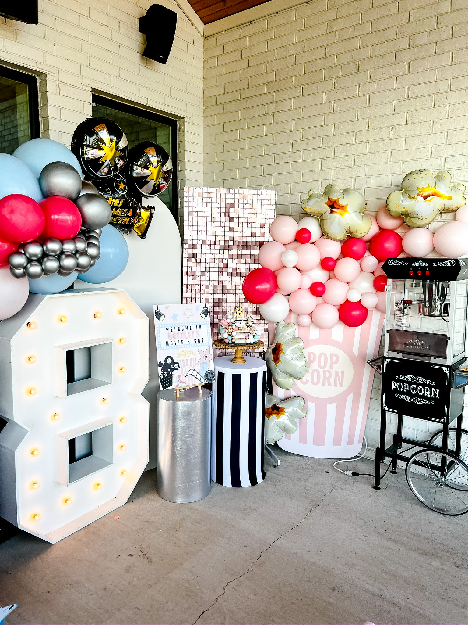 movie night, movie night themed party, movie night decor, movie camera balloons, popcorn balloons, vintage popcorn machine, large number 8 LED sign