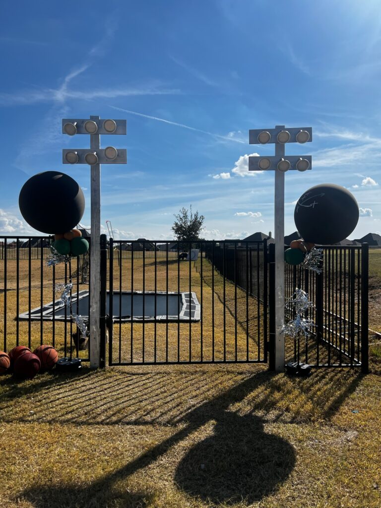 football birthday bash set up, stadium lights props, in-ground trampoline, backyard football birthday set up